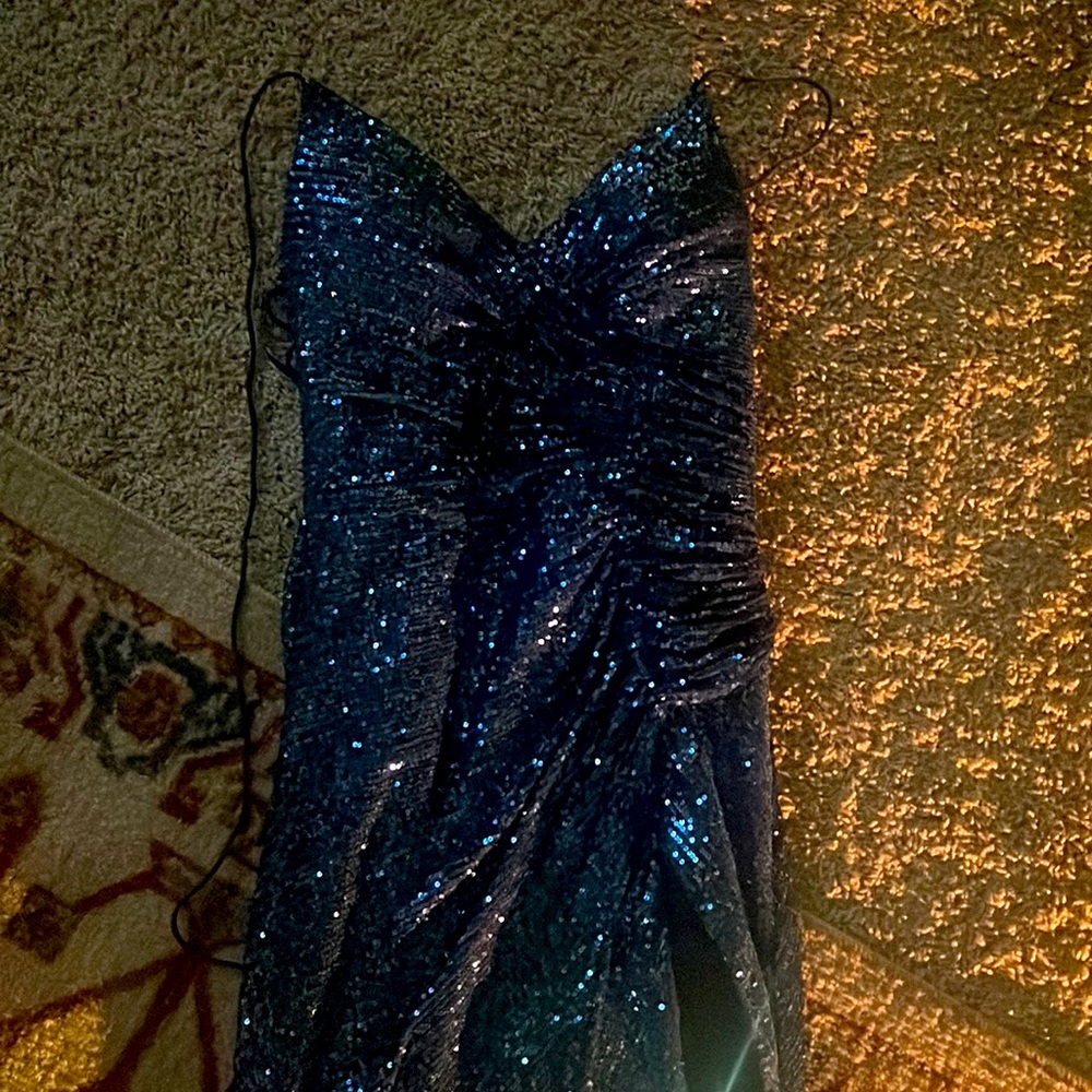 This Aria Bridal and Formal Wear medium sized blue sequin long backless dress